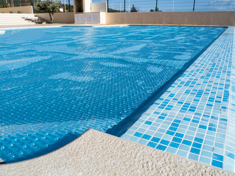 How a pool cover can save you money on heating costs
